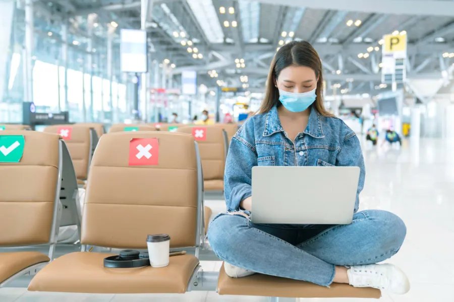asian-female-casual-cloth-wear-virus-protective-face-mask-sit-with-social-seat-distancing-new-normal-lifestyle-enjoy-hand-work-use-laptop-airport-terminal-safety-travel-concept